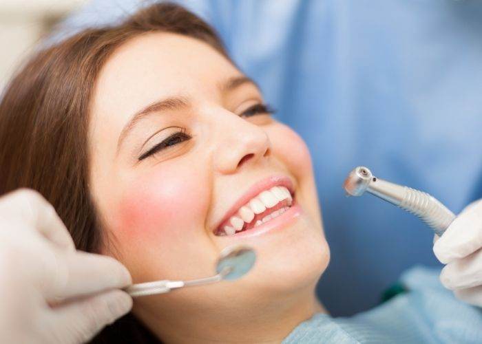 woman smiling receiving orthodontic treatment