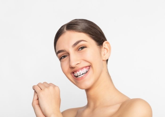 woman with metal braces smiling