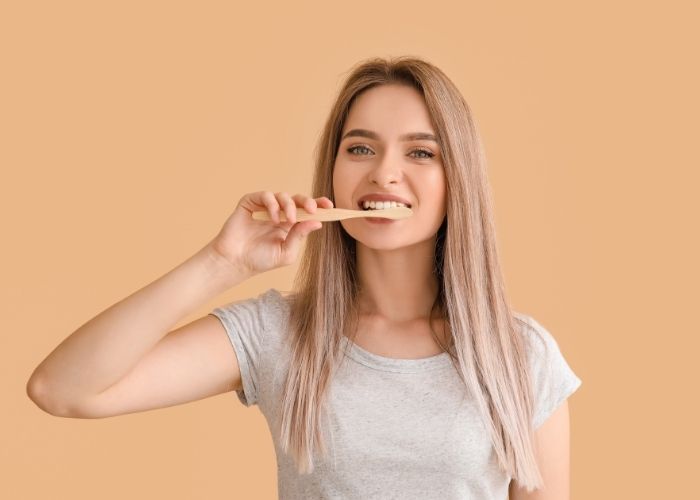 woman brushing teeth